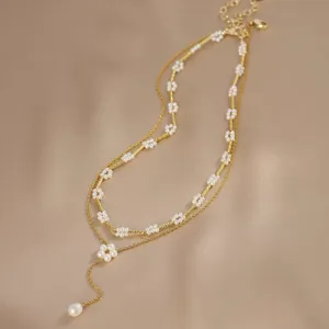 Französische zweilagige Goldkette mit Perlenblumen und elegantem Quastenanhänger