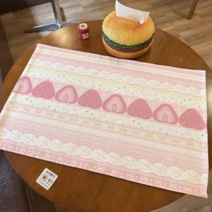 Pink cotton linen tablecloth featuring cute strawberry and bow print, perfect for desk and home decor.