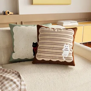 Cute cartoon cat toast throw pillows styled on a cozy sofa, perfect living room cushion detail.