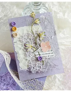 Vintage scrapbooking paper decorative cards with dried flowers lace and journaling supplies.