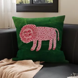 Green square throw pillow with retro pink lion illustration, vintage decorative sofa cushion.