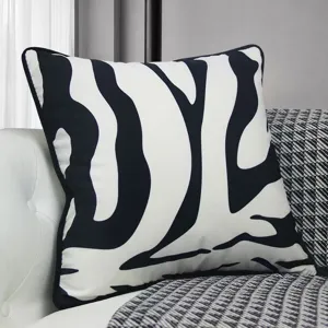 Modern black and white abstract throw pillow cover detail view for cozy living room sofa.