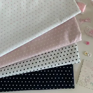Detailed view of cute star pattern fabric in various colors for photography background use.