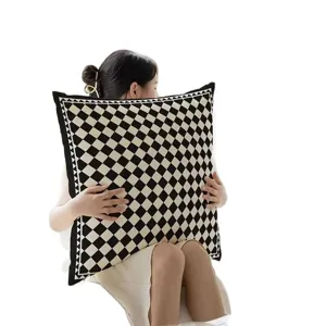 Retro luxury decorative pillow with chic geometric checkerboard pattern for living room sofa.