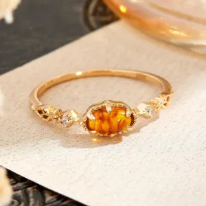 Detailed close-up view of a vintage S925 silver ring with amber-colored stone inlay