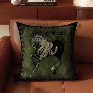 French vintage style green cushion detail showing ornate golden horse pattern on soft fabric.