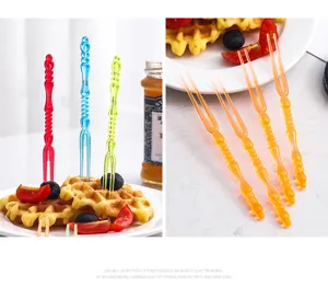 Creative colorful plastic fruit forks for waffles and fresh fruit dessert picks