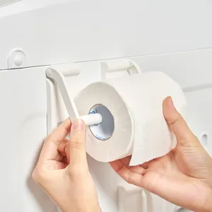 Minimalist white magnetic refrigerator side rack for kitchen paper towels shown with hands