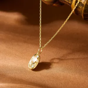 Macro detail of misty pink rose quartz pendant in S925 gold plated silver necklace