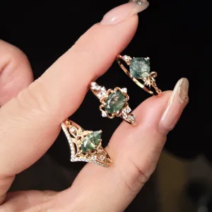 Close-up detail of vintage moss agate rings in gold-plated sterling silver settings