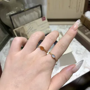 Detail view of vintage s925 silver rings featuring natural labradorite and chalcedony.
