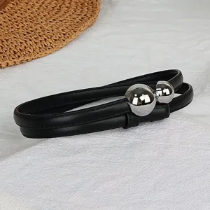 Black thin leather belt for women with stylish silver spherical metal buckle accessory chic.