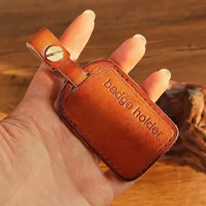 Handmade genuine leather badge holder key chain protective cover for access cards detail.