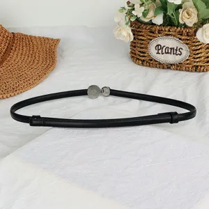Versatile women's thin black belt with silver snap buckle, perfect for dresses and sweaters.