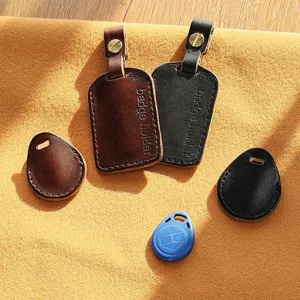 Detailed view of handmade cowhide leather badge holder and mini key card protective cover.
