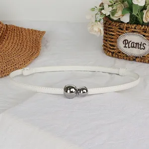 Elegant women's thin white leather belt with double silver ball buckle for dress styling.