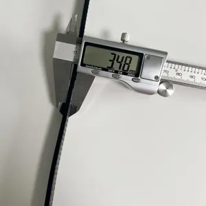 Detailed shot showing the precise thickness of the leather belt measured with digital caliper.