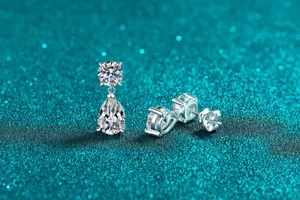 Detailed close-up of sparkling pear-shaped Moissanite drop earrings crafted in S925 sterling silver