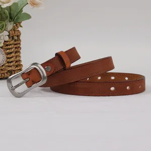 Brown genuine leather belt detail showcasing classic pin buckle and double stitching.