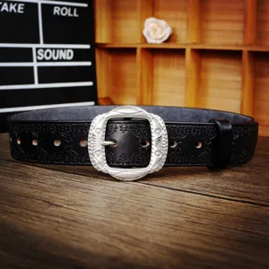 Vintage men's genuine leather belt with ornate silver buckle and embossed pattern.