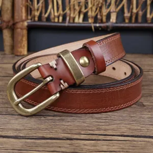 Brown genuine leather women belt with vintage metal buckle, soft cowhide jeans detail.