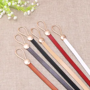 Detail view of fashionable thin leather belt with metal water drop loop buckle in multi colors.