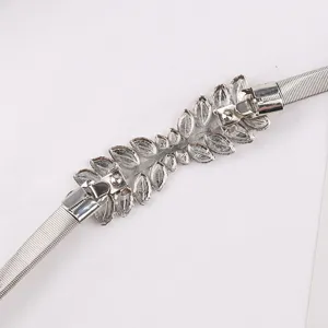 Silver metal elastic waist belt featuring a delicate leaf design buckle for women elegant outfits.