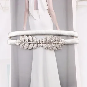 Silver elastic metal waist chain detail, elegant leaf buckle, perfect for dresses.