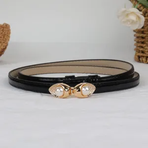 Women's thin black patent leather belt with gold pearl interlocking buckle for dress.