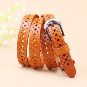 Detailed view of women's genuine leather hollow belt, elegant diamond pattern with buckle.