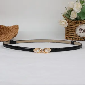 Women's thin black patent leather belt with chic gold pearl interlocking buckle for dress.