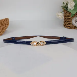 Sweet pearl buckle thin leather belt for women, stylish accessory for daily dresses.