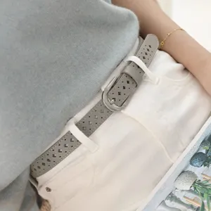 Chic women leather belt with stylish hollow design, versatile thin waist accessory for jeans or dresses.