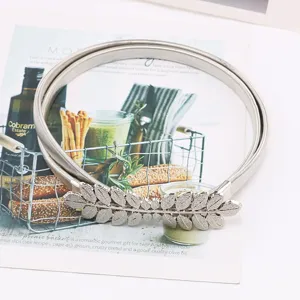 Silver metal waist chain elastic belt with leaf buckle, perfect for dresses and sweaters.