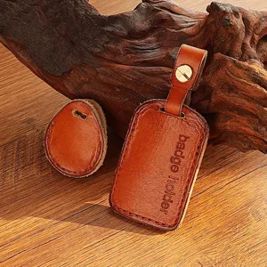 Handmade brown leather badge holder detail, access card protector cover with metal snap rivet.