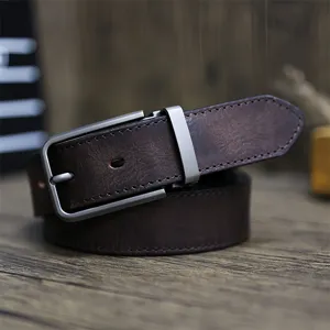 Handmade genuine leather belt detail shot featuring vintage distressed cowhide and metal buckle.