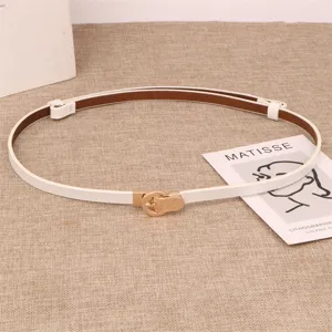 Women white thin leather belt with gold metal buckle, stylish minimalist waist accessory.