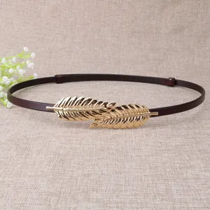 Women thin belt detail, stylish dark brown leather strap with elegant gold leaf metal buckle.