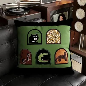 Vintage style throw pillow detail showing retro illustrative window design on green and black fabric.