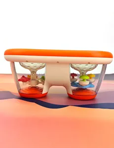 Detailed closeup of the baby musical drum toy with colorful rotating carousel inside.