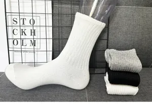 Detailed view of white ribbed mid-calf socks on mannequin with grey and black options.