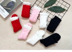 Detail view of soft fuzzy coral fleece socks, warm winter sleep floor socks in multi colors.