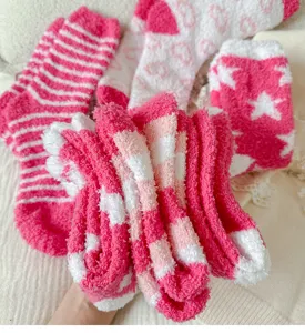 Cozy pink fuzzy fleece socks for women, soft winter warm home floor socks with cute patterns.