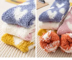 Thick coral fleece fuzzy socks for women, cozy winter warm sleep floor socks with cute heart pattern.