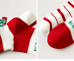 Red and white striped socks detail close-up, comfortable cotton material, stylish daily wear.