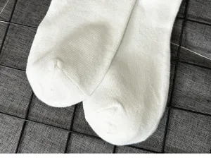 White knit socks detail close-up, soft cotton blend mid tube socks for daily wear and comfort.