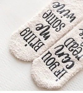 Cozy fuzzy fleece floor socks detail with anti-slip lettering text for winter warm home wear