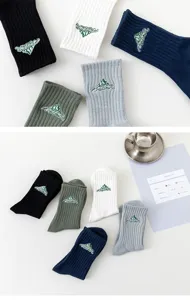 Detailed view of Japanese streetwear mountain embroidered cotton socks in various colors.