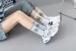 Detail shot of stylish cotton mid-tube socks with retro cartoon prints, soft and comfortable.