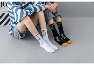 Detailed view of street style cotton mid-calf socks with robot text and badge design worn by models.